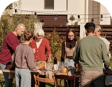 Happy family enjoying backyard barbecue get-together